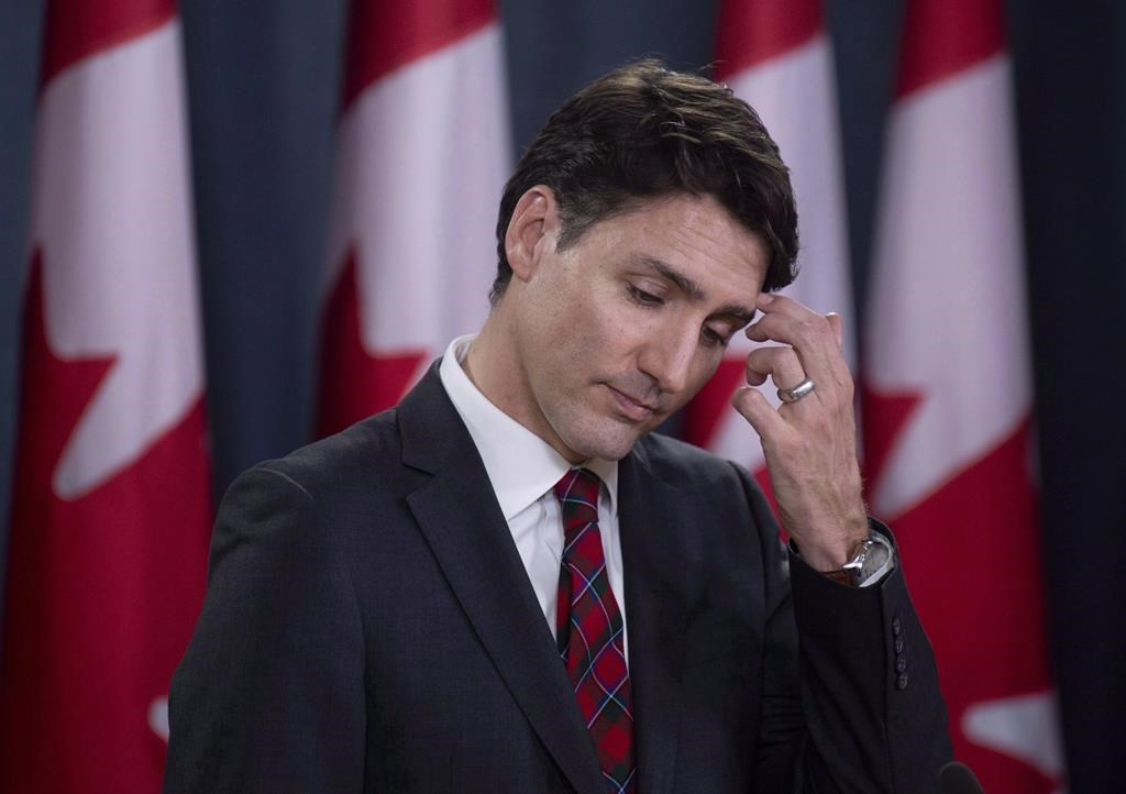 Canadian Prime Minister Justin Trudeau scratches his forehead as he listens to a question during an end of session news conference in Ottawa on December 19, 2018. The Trudeau government plans for child care spending is facing an election-year critique from an academic paper that calls on the Liberals to rethink its daycare plan if it wants to bill itself as a "feminist government." Federal coffers are set to dole out $7.5 billion over a decade to help fund child care spaces across the country, and the government has issued invitations to an event Wednesday with the minister in charge of the file. THE CANADIAN PRESS/Adrian Wyld.