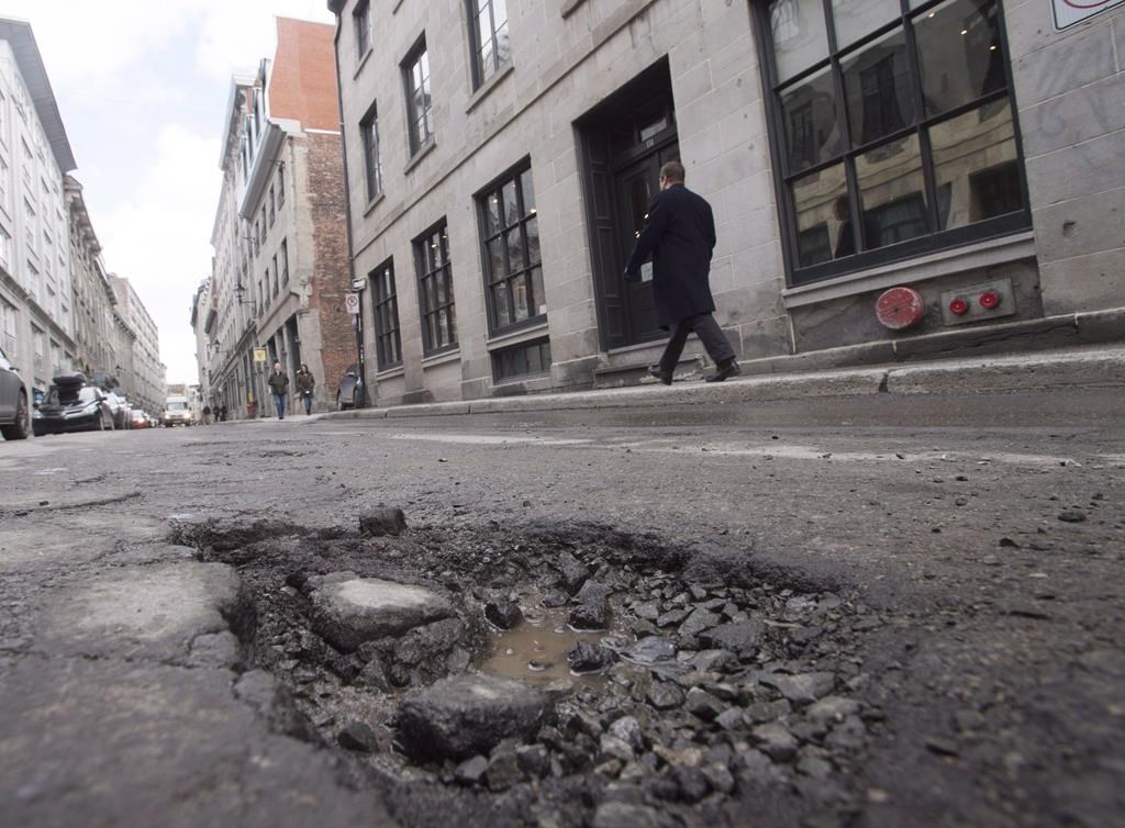 A pothole is seen on St. Paul street Friday, March 18, 2016 in Montreal.