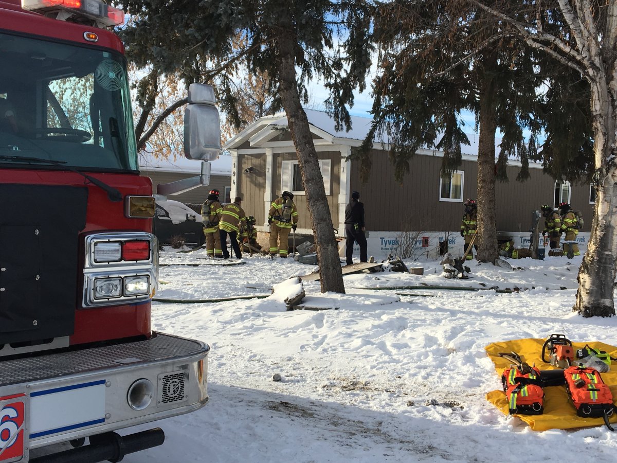 Edmonton firefighters put out a blaze at a home in the city's south end, Tuesday, Jan. 1, 2019. 