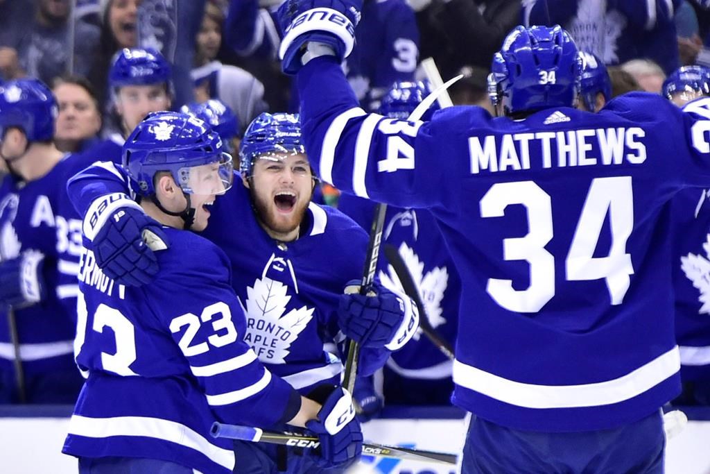 Toronto Maple Leafs right wing William Nylander (centre) celebrates his goal against the Minnesota Wild with teammates Travis Dermott (23) and Auston Matthews (34) during second period NHL hockey action in Toronto on Thursday, Jan.3, 2019.