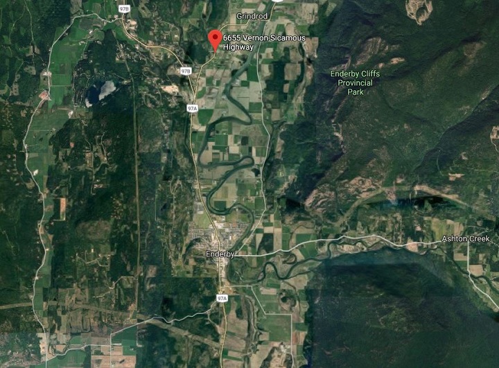 A gravel truck that has rolled over has closed a section of Highway 97A north of Enderby.