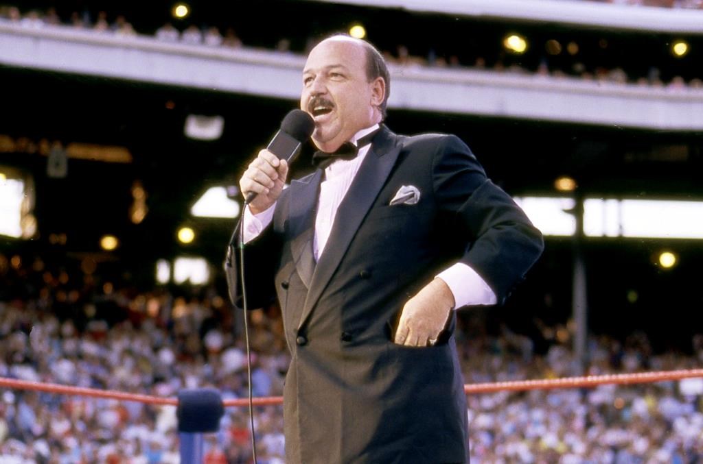 In this July 31, 1988 photo, “Mean” Gene Okerlund addresses the crowd before a pro wrestling event in Milwaukee.