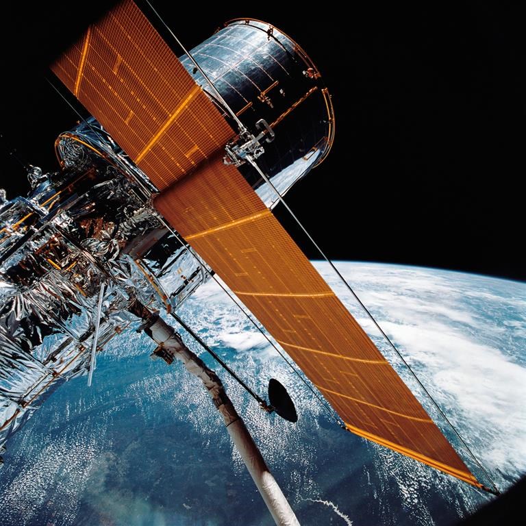 In this April 25, 1990, photograph provided by NASA, most of the giant Hubble Space Telescope can be seen as it is suspended in space.