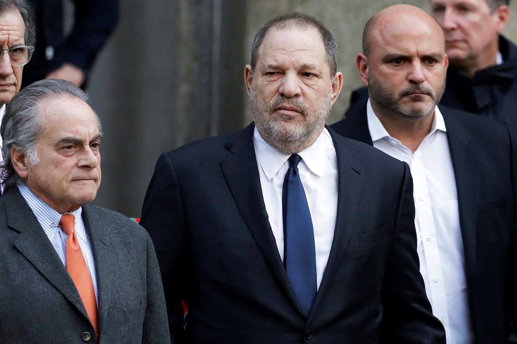 Harvey Weinstein, centre, leaves New York Supreme Court with his attorney Benjamin Brafman, left, in New York on Dec. 20, 2018.