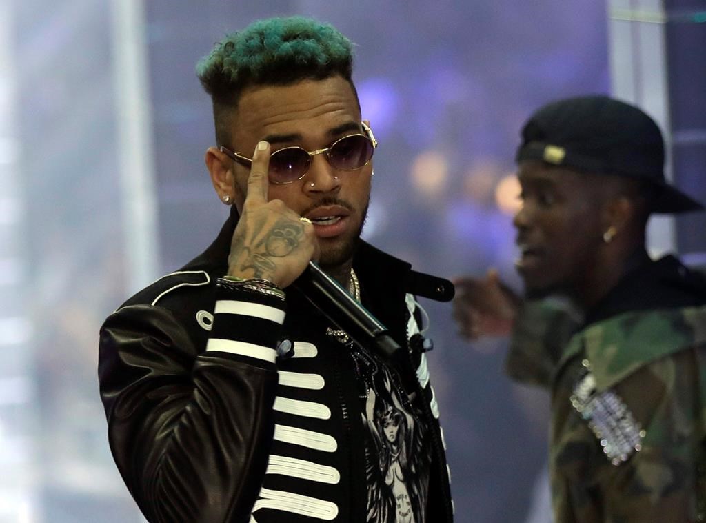 Singer Chris Brown performs during Philipp Plein's women's 2019 spring-summer collection, unveiled during Fashion Week in Milan, Italy on Sept. 21, 2018.