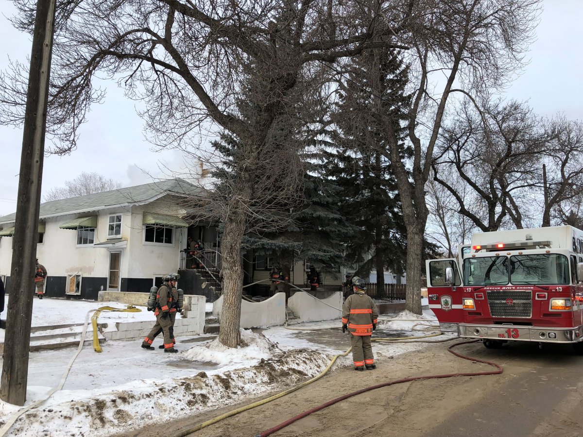 Firefighters battled a single storey residential home with smoke and flames visible from the right side of the structure causing the vacant two storey home next door to ignite. 
