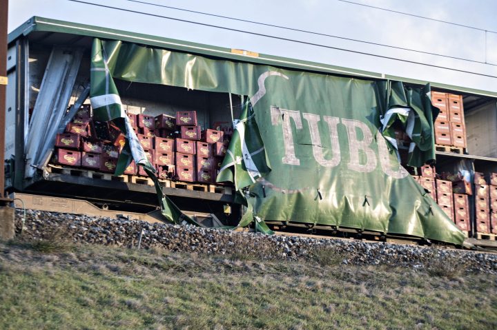 Damaged compartments of a cargo train near the Storebaelt bridge, near Nyborg in Denmark, Wednesday, Jan. 2, 2019.