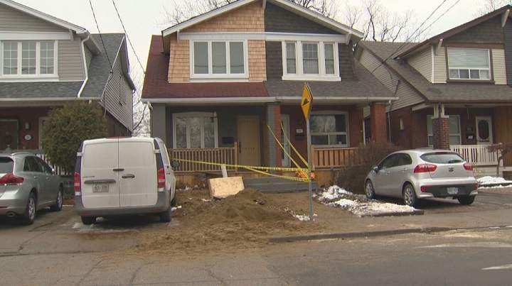 The home on which the man was working when he became buried. Toronto fire says he was digging in the front of the house.
