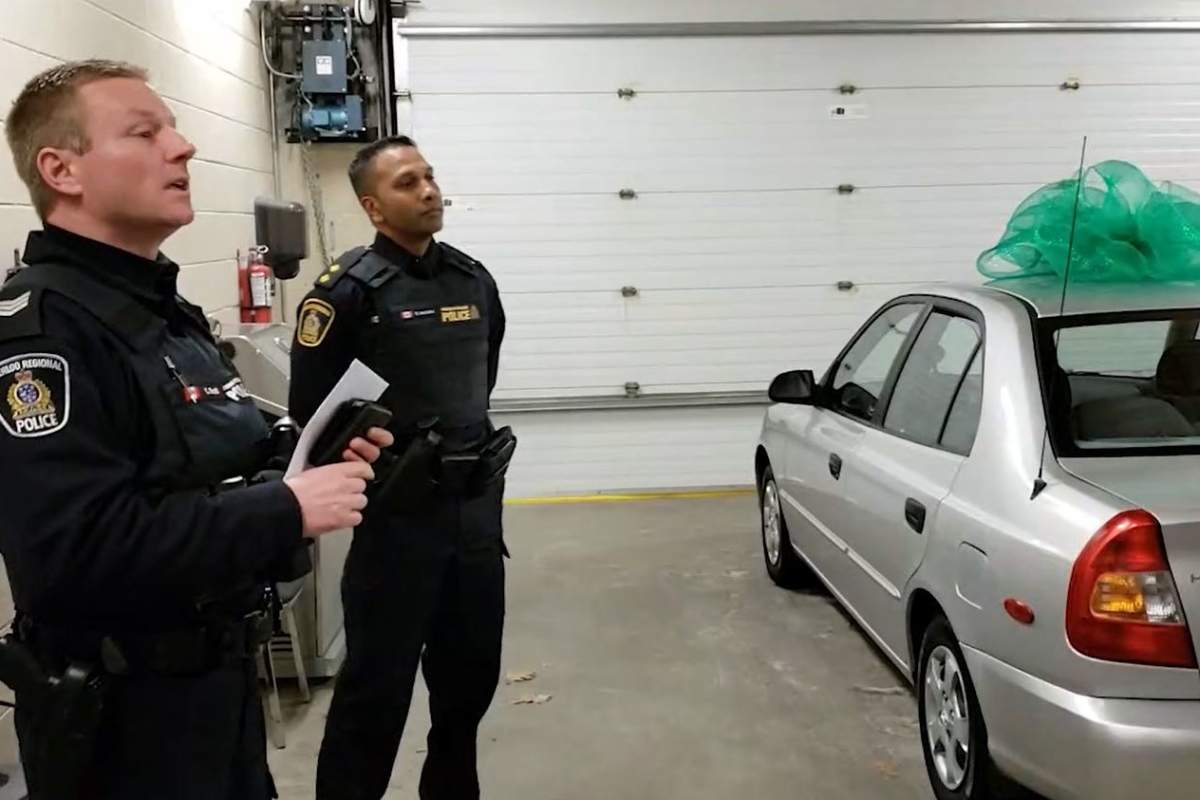 Waterloo Regional Police Acting Sgt. Craig Scott (left) and Acting Insp. Shamal Isaacksz help present the Hyundai sedan to their colleague.