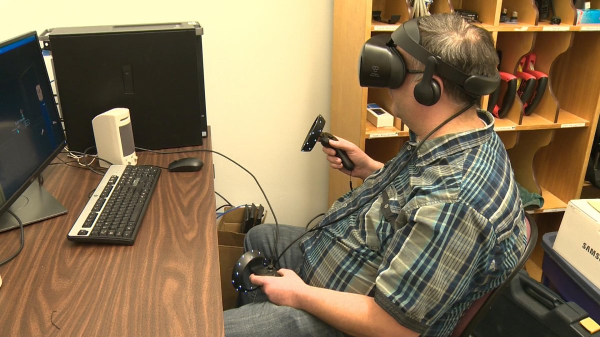 Michael McCready shows off the virtual reality technology for anyone in the Lethbridge College book club.