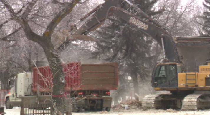 The city halted demolition of the former CNIB building in Wascana Park on Tuesday.