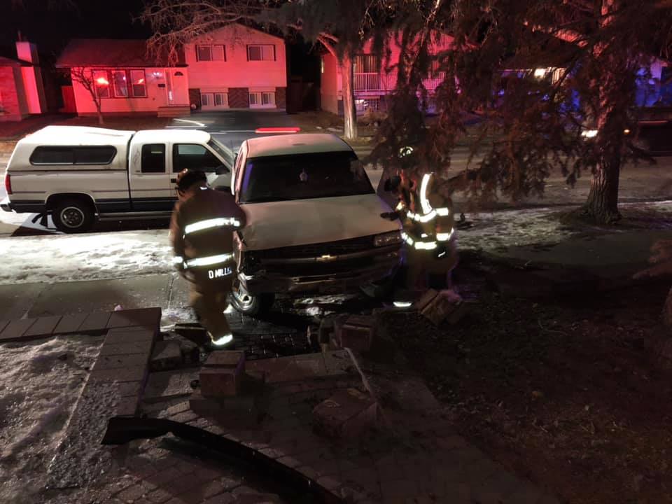 First responders attend to a vehicle involved in a hit and run outside Gwen Ferridge's home in Calgary on Jan. 31. 