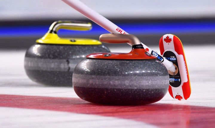 A Team Canada broom marks a stone during the Scotties Tournament of Hearts in St. Catharines, Ont., on Saturday, Feb. 18, 2017.
