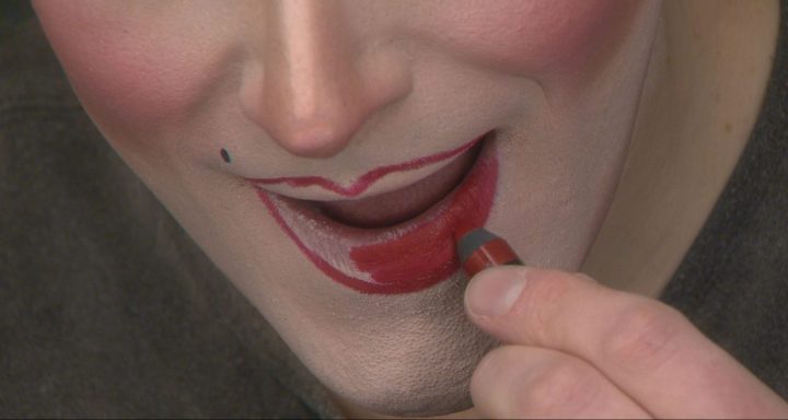 Justin Miller applies lipstick, getting into his drag character, Pearle Harbour, for Calgary’s High Performance Rodeo.