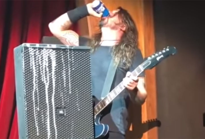 Foo Fighters’ frontman Dave Grohl slams a beer during a show in Las Vegas. 