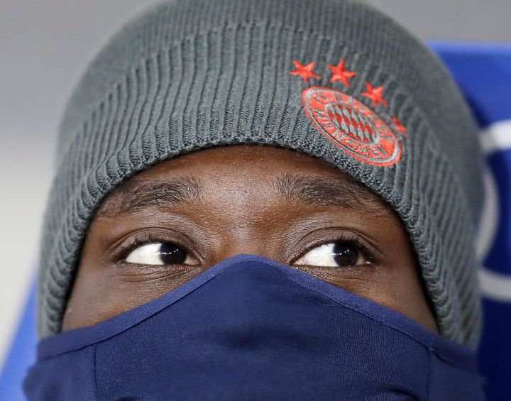 Munich’s Alphonso Davies sits on the bench during a German Bundesliga soccer match between TSG 1899 Hoffenheim and Bayern Munich in Sinsheim, Germany, Friday, Jan. 18, 2019.