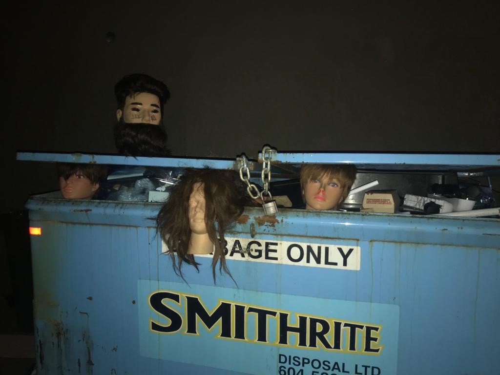 A dumpster full of mannequin heads discovered in Delta on Monday. 