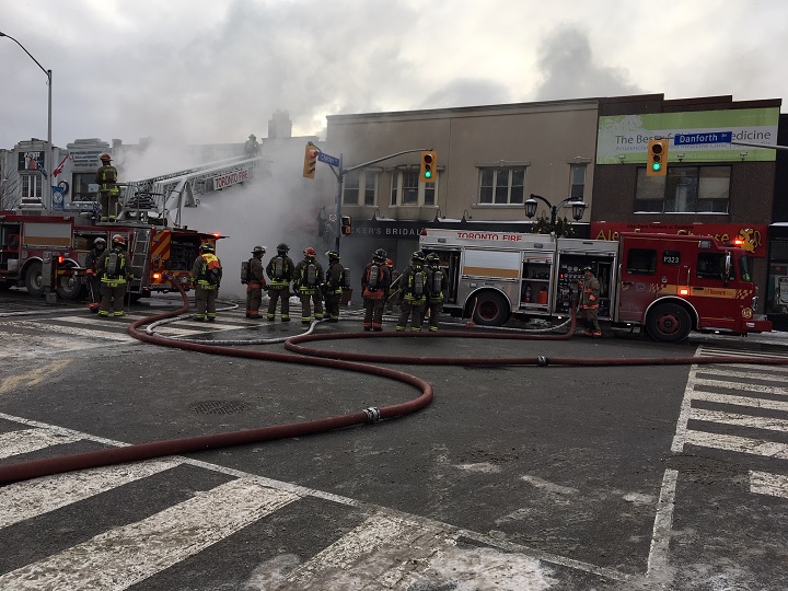 Fire crews battle a four-alarm blaze at a two-story building on Danforth Avenue on Jan. 22, 2019.