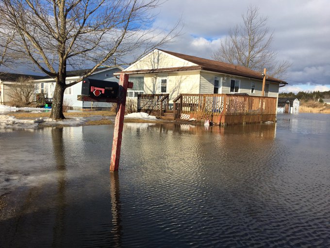 Houses stand among flood waters on Golden Grove Road in Saint John on January 25, 2019.