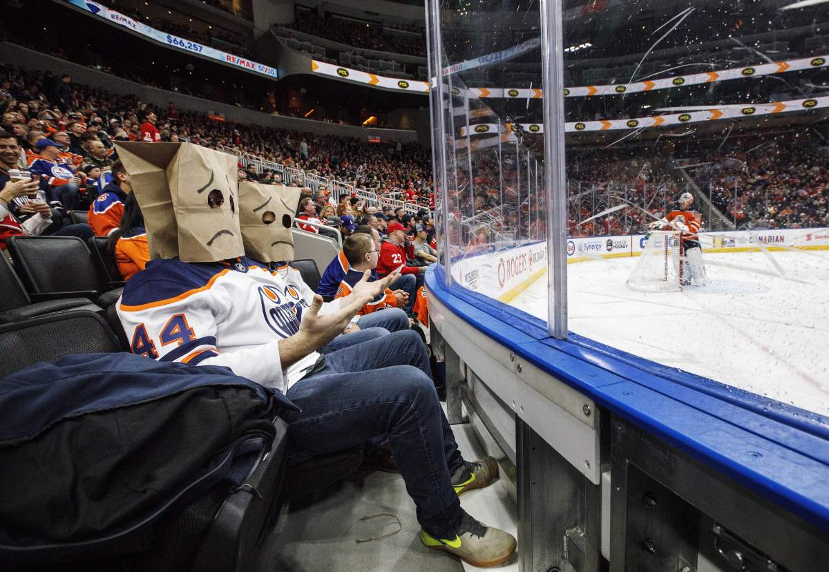 Edmonton Oilers fans react after Detroit Red Wings score a goal during third period NHL action in Edmonton on Tuesday, Jan. 22, 2019. THE CANADIAN PRESS/Jason Franson