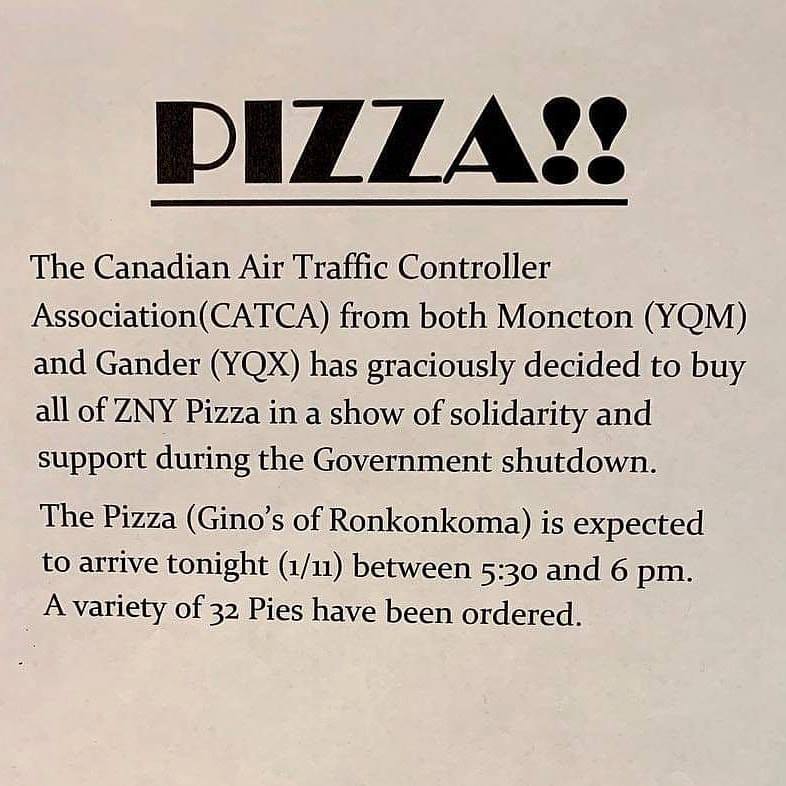The sign that that had been hung at the New York Air Traffic Control Center in Ronkonkoma, N.Y., that said 32 pizzas had been ordered by Canadian air traffic controllers in Moncton and Gander.