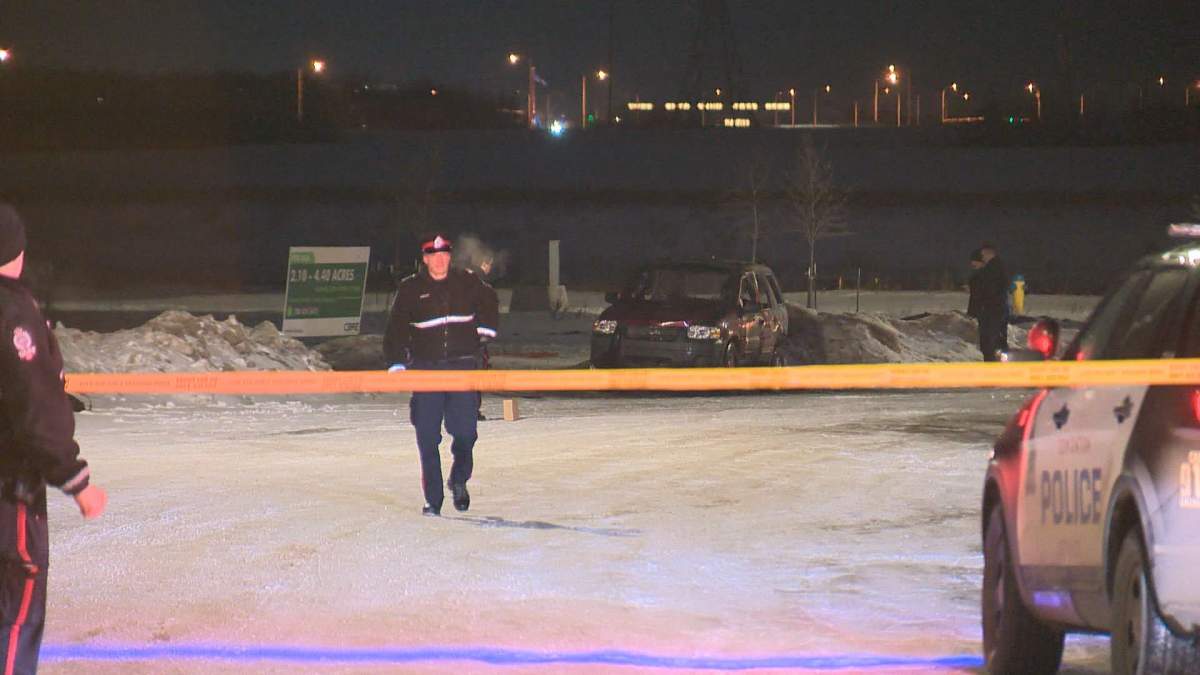 Edmonton police and firefighters were called to 164 Street, north of 137 Avenue on Sunday, where a woman was found dead inside a burning vehicle. 