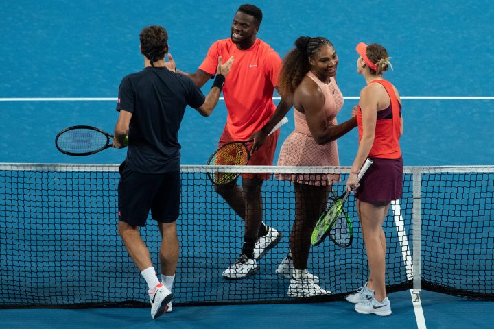 Frances Tiafoe (second left) and Serena Williams (second right) of the USA congratulate Roger Federer (left) and Belinda Bencic (right) of Switzerland after they won the mixed doubles match between Roger Federer and Belinda Bencic of Switzerland and Frances Tiafoe and Serena Williams of the USA on day 4 of the Hopman Cup tennis tournament at RAC Arena in Perth, Western Australia, Australia, 01 January 2019.