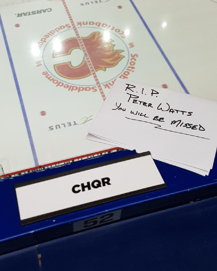 A tribute for Peter Watts in the Calgary Flames press box at Scotiabank Saddledome.