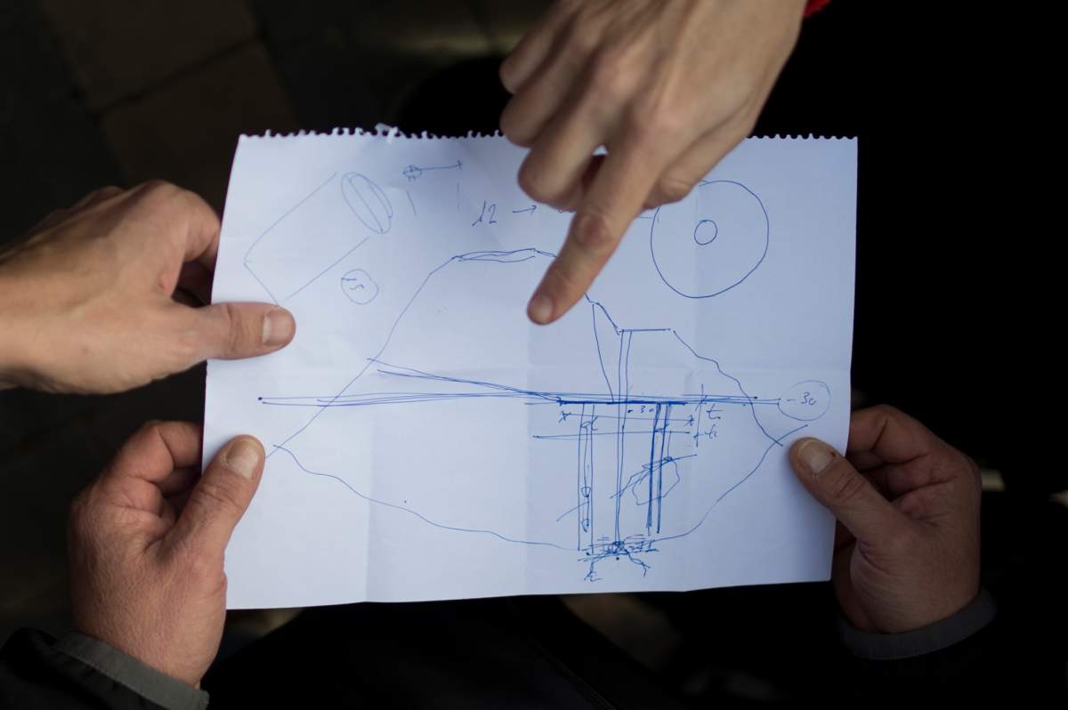 Officials show an excavation map during efforts to find a boy who fell down a well in Totalan in southern Spain.