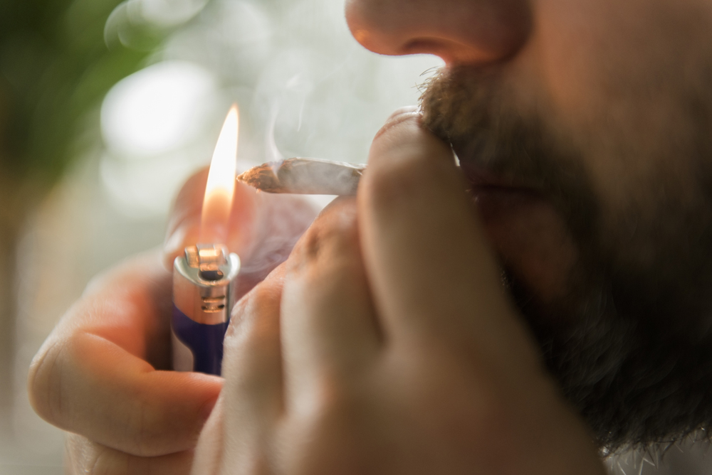A man lights a joint in this file image. 