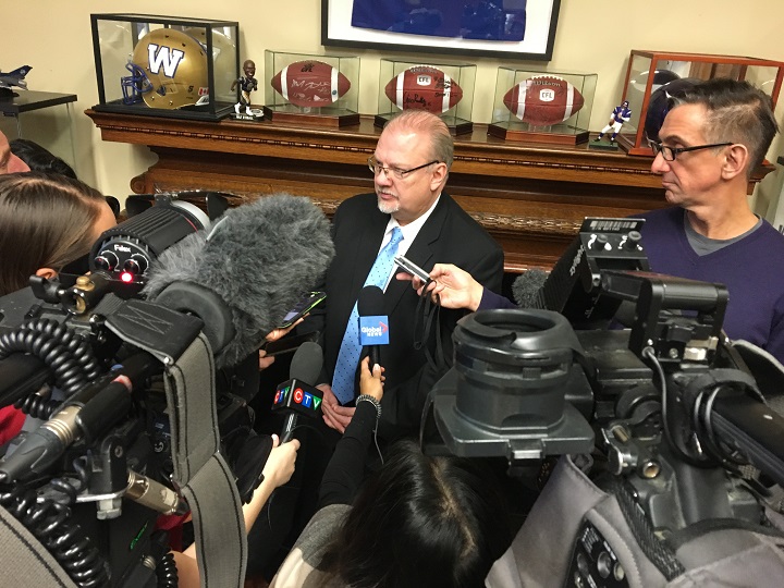 Education Minister Kelvin Goertzen speaks to reporters inside his office after Thursday’s education funding announcement.