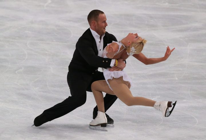 Caydee Denney, right, and John Coughlin, left, of the United States, perform in the pairs free skating event at the ISU Figure Skating Eric Bompard Trophy, at Bercy arena in Paris on Saturday, Nov. 16, 2013.