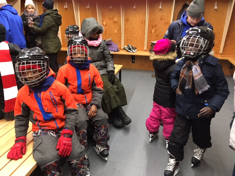 Kids ready to go skating for the first time.