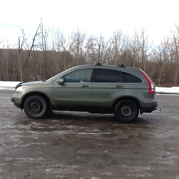 The vehicle is a light green 2009 Honda CR-V with the Alberta licence plate 48-M554.