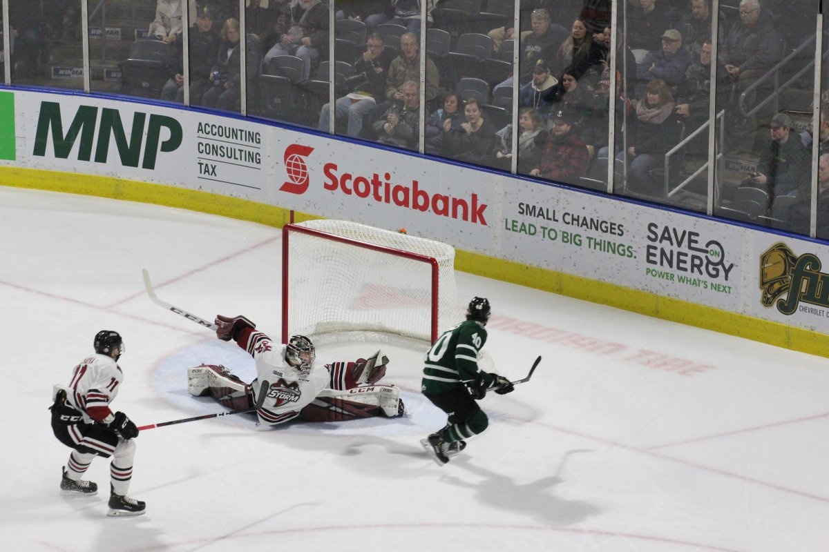 London, Ont. - Tonio Stranges of the London Knights is denied by the spread-eagle glove of Anthony Popovich of the Guelph Storm in a game at Budweiser Gardens on January 8, 2019.