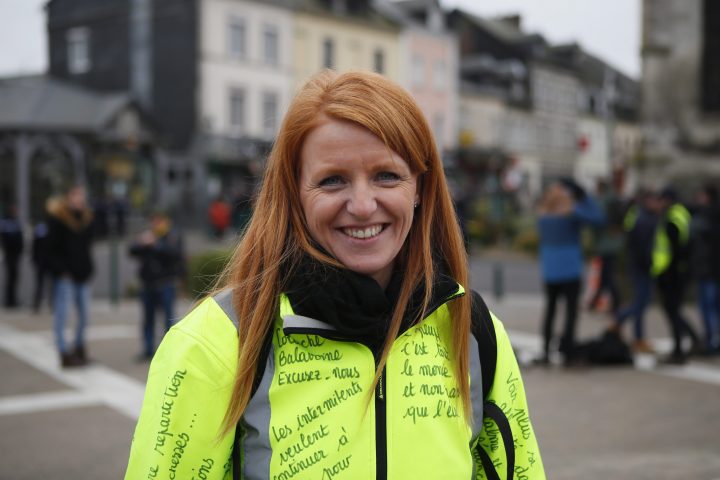 Ingrid Levavasseur, one of the leading figures of France’s yellow vests protests, smiles as she waits for French President Emmanuel Macron’s visit in Bourgtheroulde, Normandy, Tuesday, Jan. 15, 2019.