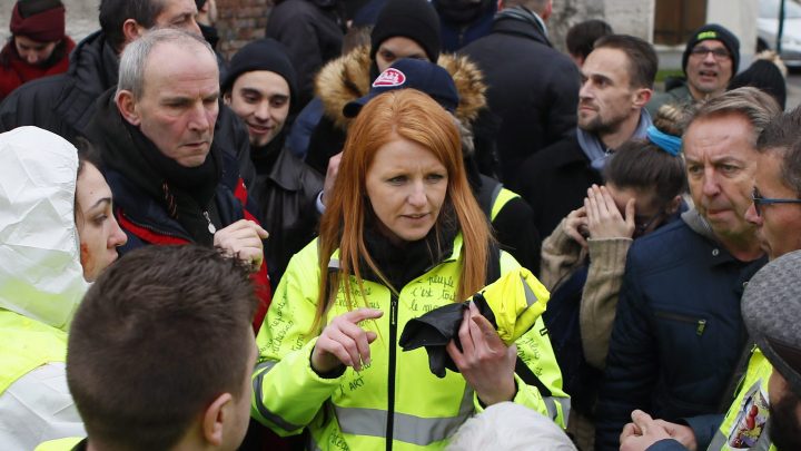 Ingrid Levavasseur, centre, one of the leading figures of France’s yellow vests protests, talks to residents and protesters as she waits for French President Emmanuel Macron’s visit in Bourgtheroulde, Normandy, Tuesday, Jan. 15, 2019.