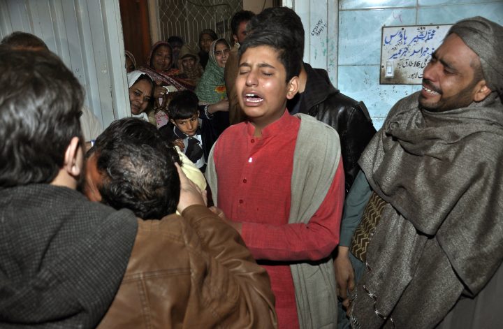 Relatives of a family killed by counter-terrorism officers mourn the family’s death, outside their home in Lahore, Pakistan, Saturday, Jan. 19, 2019.
