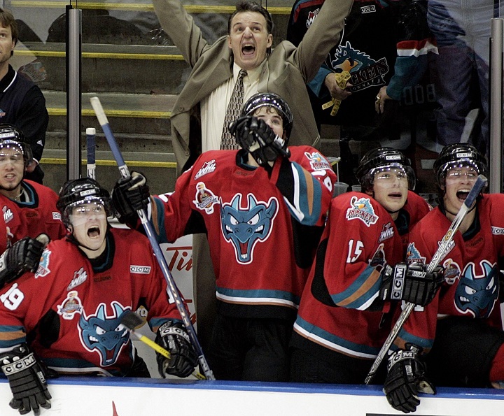 Kelowna Rockets coach Marc Habscheid, behind, celebrates as the clock counts down en route to their 2004 Memorial Cup victory over the Gatineau Olympiques on Sunday, May 23, 2004 in Kelowna. In front of Habscheid, from left, are Chris Ray, Justin Keller, Troy Bodie, Tyler Spurgeon and Blake Comeau.