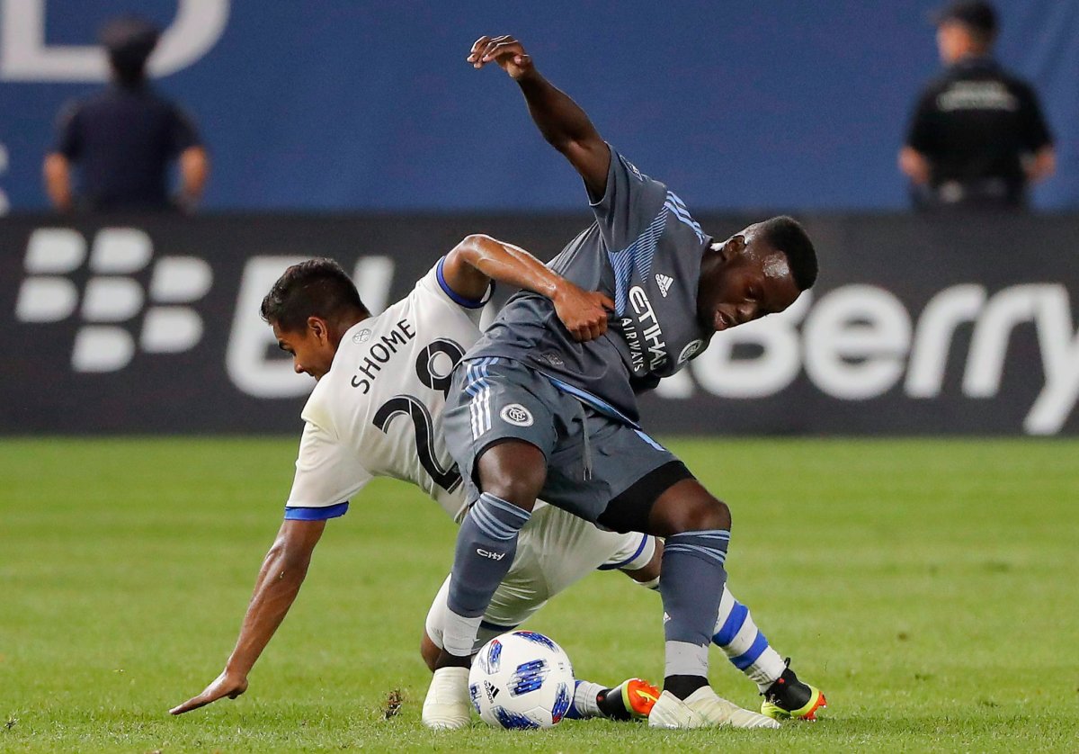 Montreal Impact midfielder Shamit Shome (28) gets tangled up with New York City FC midfielder Kwame Awuah during the second half of an MLS soccer match Wednesday, July 11, 2018, in New York. NYCFC won 3-0.