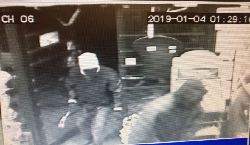 Police say the suspects filled up garbage cans with cartons of cigarettes then fled.