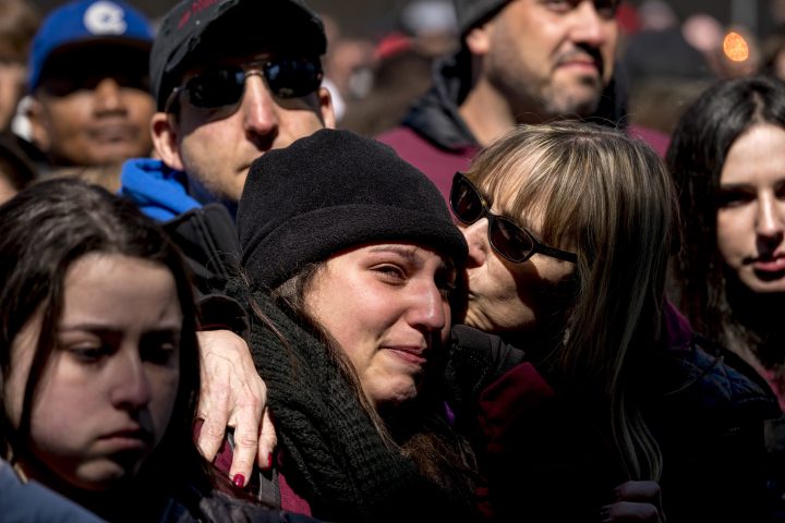 In this Saturday, March 24, 2018 file photo, members of the audience react as Edna Chavez of Manual Arts High, south of downtown Los Angeles, speaks during the “March for Our Lives” rally in Washington, in support of gun control.