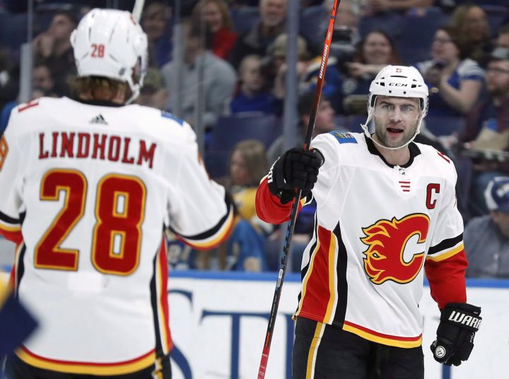 Calgary Flames’ Mark Giordano, right, is congratulated by Elias Lindholm after scoring during the first period of an NHL hockey game against the St. Louis Blues Sunday, Dec. 16, 2018, in St. Louis. Considerable grumbling emanated from Flames Nation when defenceman Mark Giordano was passed over for the NHL all-star game.