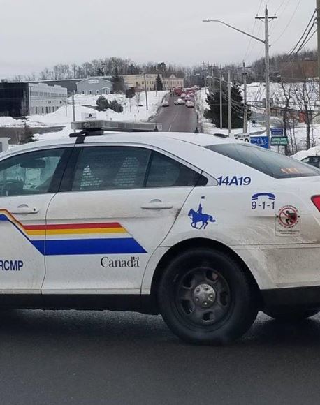 A New Brunswick RCMP cruiser blocks off a section of road in Dieppe, N.B., as they investigate an “ongoing incident” on Saturday, Jan. 5, 2019.