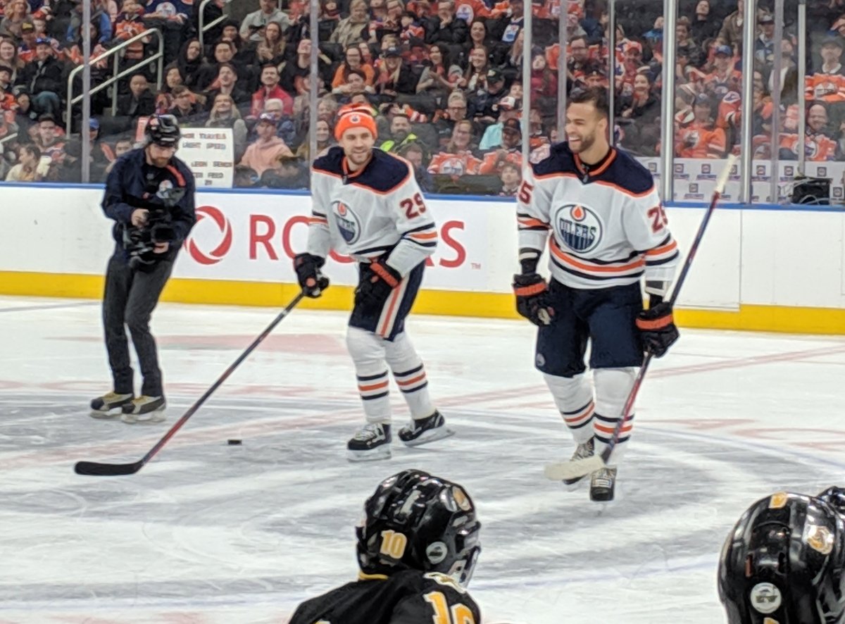 Leon Draisaitl and Darnell Nurse share a laugh after Nurse wins the hardest shot at the Edmonton Oilers Skills Competition on Jan. 13, 2019. 