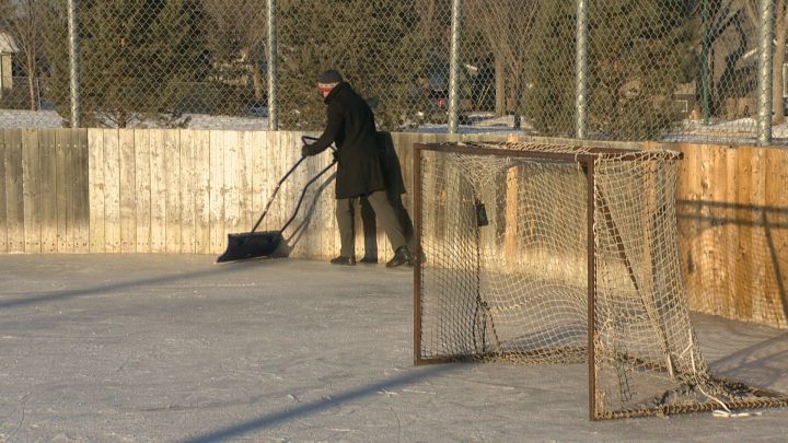Josh Remai clearing snow at the Achs Park Outdoor Rink.