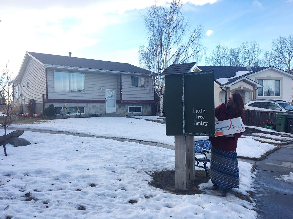 Margot Baker filling up the Free Pantry