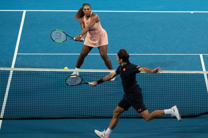 Serena Williams of the USA and Roger Federer of Switzerland in action during the mixed doubles match between Roger Federer and Belinda Bencic of Switzerland and Frances Tiafoe and Serena Williams of the USA on day 4 of the Hopman Cup tennis tournament at RAC Arena in Perth, Western Australia, Australia, 01 January 2019. 