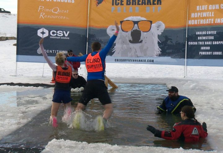 Amazing Race Canada contestants Julie and Lowell Taylor took a dip in frigid waters in Calgary on New Year's Day.