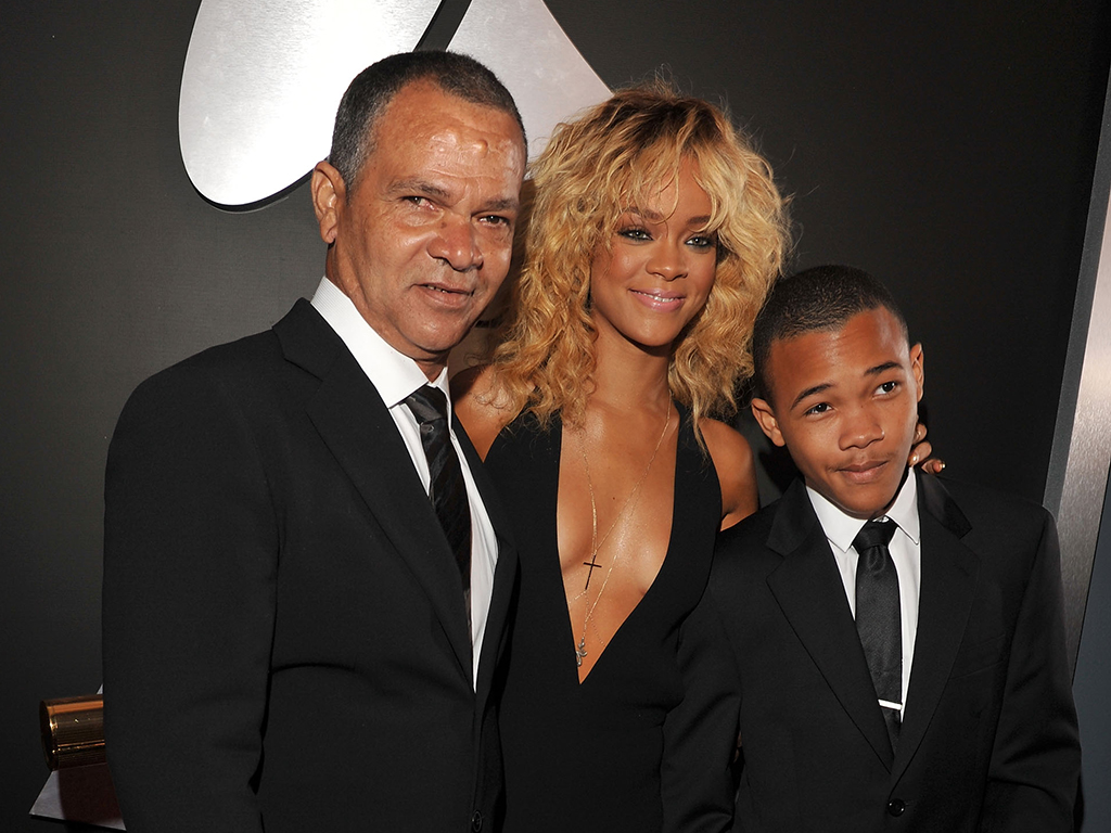 (L-R) Ronald Fenty, Rihanna and Rajad Fenty arrive at The 54th Annual Grammy Awards at the Staples Center on Feb. 12, 2012, in Los Angeles, Calif.